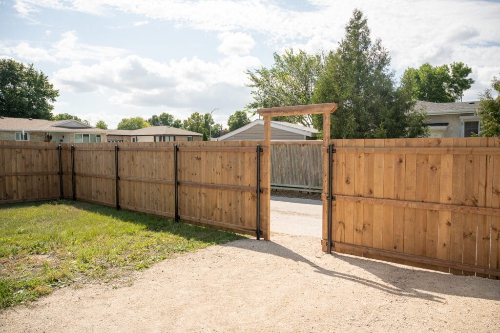 Wood Fence With Black Steel Posts