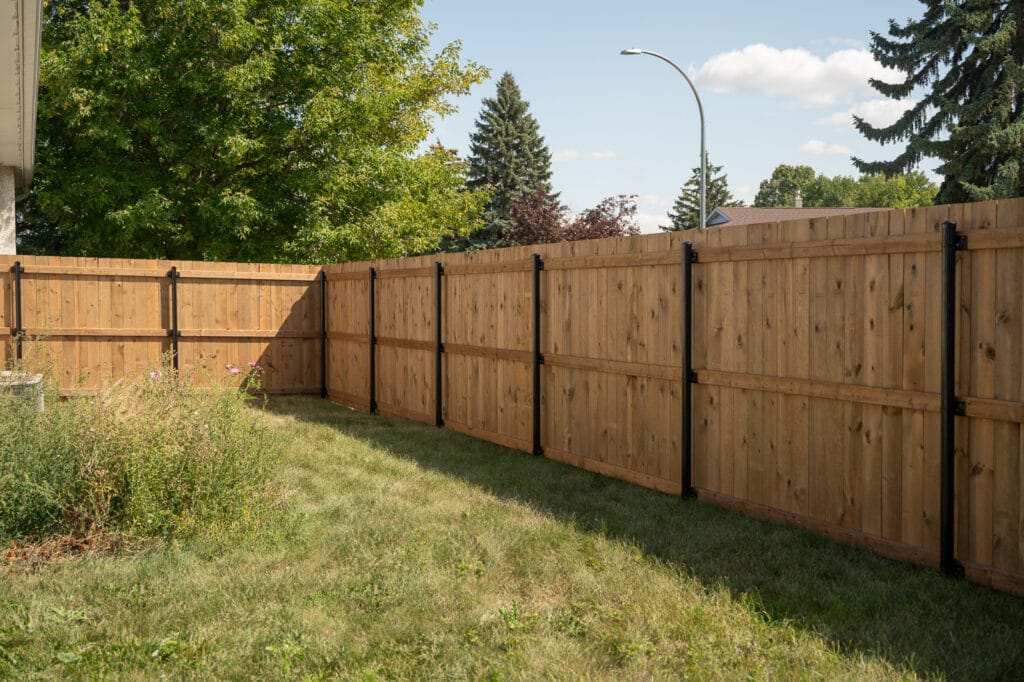 Wood Fence With Black Steel Posts