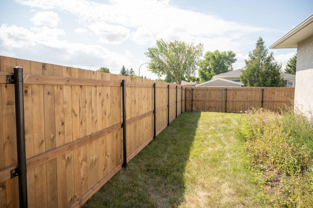 Wood Fence With Black Steel Posts